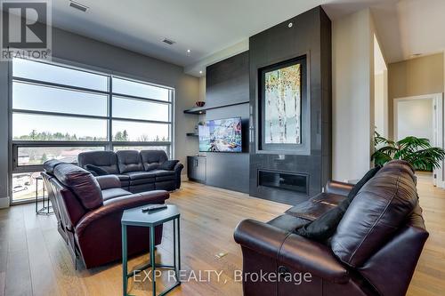 404 - 1705 Fiddlehead Place, London North (North R), ON - Indoor Photo Showing Living Room With Fireplace