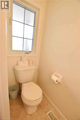 Bathroom with toilet and baseboards - 52 Meadowridge Street, Kitchener, ON - Indoor Photo Showing Bathroom
