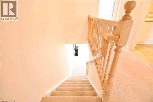 Staircase with carpet flooring and baseboards - 52 Meadowridge Street, Kitchener, ON - Indoor Photo Showing Other Room