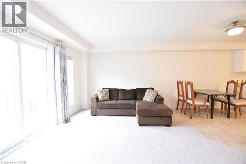 Living room featuring light carpet - 52 Meadowridge Street, Kitchener, ON - Indoor