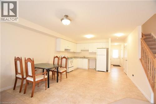 Dining space with stairs and light flooring - 52 Meadowridge Street, Kitchener, ON - Indoor