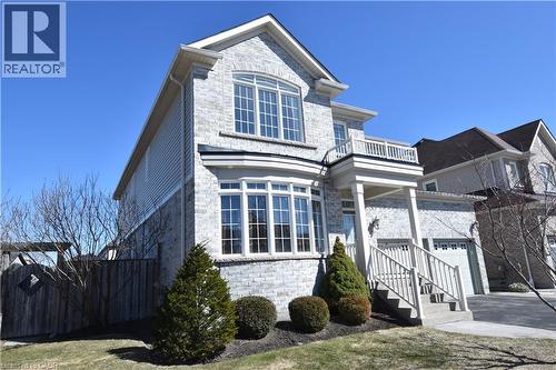 Traditional home with stone siding, driveway, and a balcony - 512 Terrington Crescent, Kitchener, ON - Outdoor