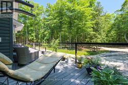 Or relax in the shade of the covered deck & trees - 