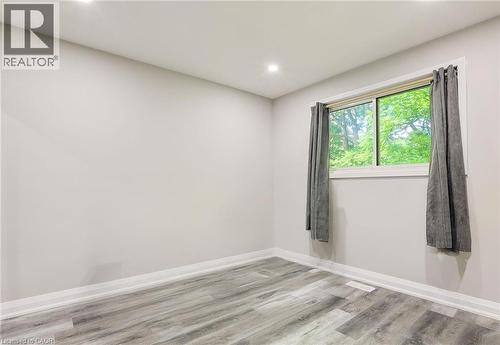 Spare room with light wood finished floors and recessed lighting - 7 Cardill Crescent, Waterloo, ON - Indoor Photo Showing Other Room