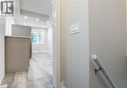 Hall with light wood-style flooring and recessed lighting - 7 Cardill Crescent, Waterloo, ON - Indoor Photo Showing Other Room