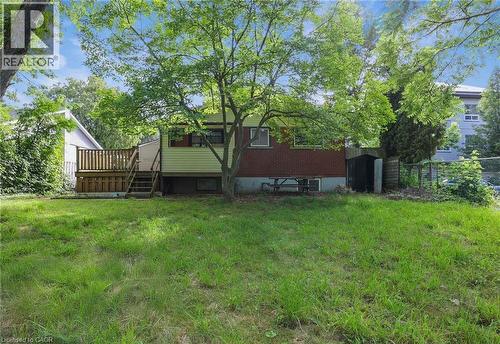 Rear view of property featuring a wooden deck and stairs - 7 Cardill Crescent, Waterloo, ON - Outdoor