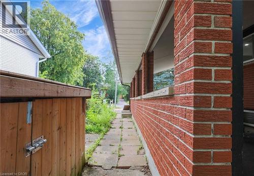 View of home's exterior with brick siding - 7 Cardill Crescent, Waterloo, ON - Outdoor With Exterior