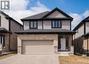 View of front of home featuring asphalt driveway, an attached garage, brick siding, and roof with shingles - 346 Chokecherry Crescent, Waterloo, ON  - Outdoor 