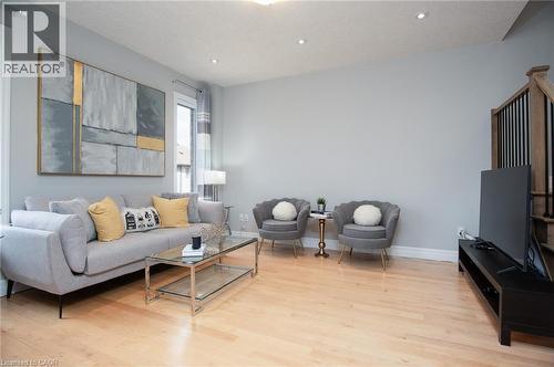 Living room with light wood-type flooring and recessed lighting - 346 Chokecherry Crescent, Waterloo, ON - Indoor Photo Showing Living Room