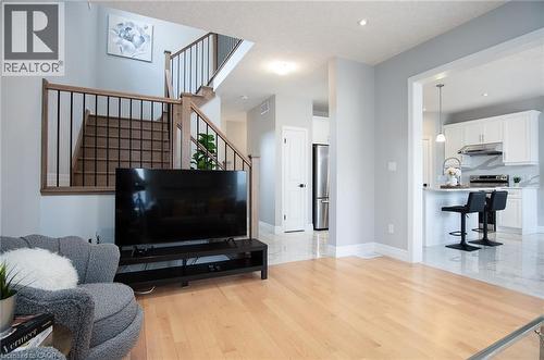 Living room featuring light wood-type flooring and recessed lighting - 346 Chokecherry Crescent, Waterloo, ON - Indoor Photo Showing Living Room