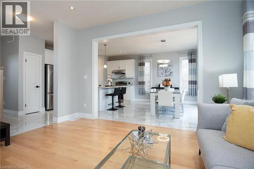 Living room with light wood-style floors and recessed lighting - 346 Chokecherry Crescent, Waterloo, ON - Indoor Photo Showing Living Room