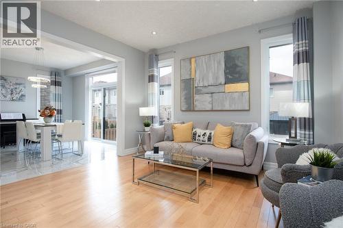 Living area with plenty of natural light and light wood-style flooring - 346 Chokecherry Crescent, Waterloo, ON - Indoor Photo Showing Living Room