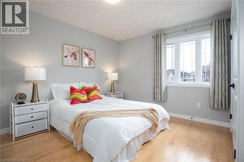 Bedroom with light wood-type flooring and a textured ceiling - 346 Chokecherry Crescent, Waterloo, ON - Indoor Photo Showing Bedroom