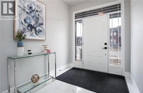 Foyer featuring light marble finish floors and healthy amount of natural light - 346 Chokecherry Crescent, Waterloo, ON - Indoor Photo Showing Other Room