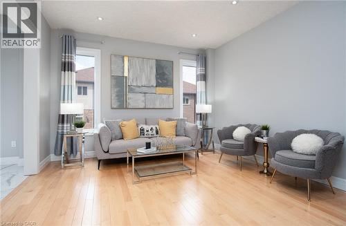 Living room with healthy amount of natural light, light wood-type flooring, and recessed lighting - 346 Chokecherry Crescent, Waterloo, ON - Indoor Photo Showing Living Room