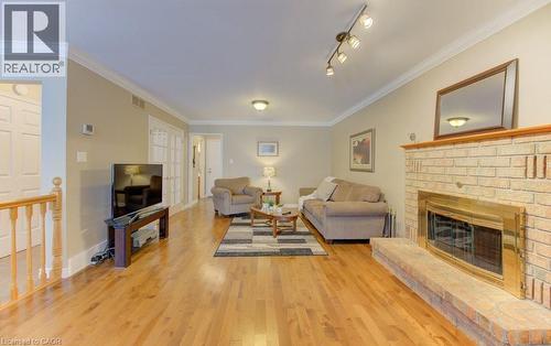 Open concept to Kitchen - 594 Hunters Place, Waterloo, ON - Indoor Photo Showing Living Room With Fireplace