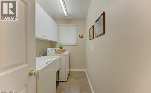 Main floor with sink - 594 Hunters Place, Waterloo, ON - Indoor Photo Showing Laundry Room