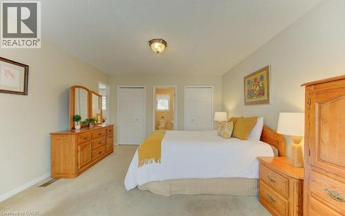 His & her closets - 594 Hunters Place, Waterloo, ON - Indoor Photo Showing Bedroom