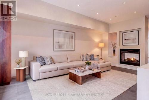 Family Room virtually staged - 66 Compass Way, Mississauga, ON - Indoor Photo Showing Living Room With Fireplace