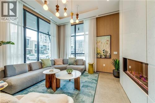 Common area with a raised ceiling - 770 Whitlock Avenue Unit# 606, Milton, ON - Indoor Photo Showing Living Room