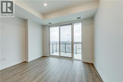 Unfurnished room featuring light wood-type flooring and recessed lighting - 770 Whitlock Avenue Unit# 606, Milton, ON - Indoor Photo Showing Other Room