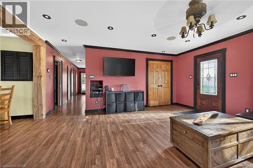 Living area with dark wood finished floors and baseboards - 703 Dunn Avenue, Hamilton, ON - Indoor