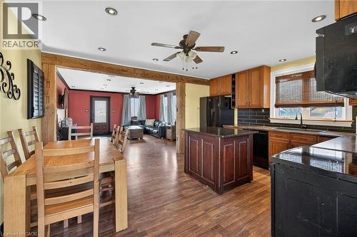 Kitchen with open floor plan, ceiling fan, plenty of natural light, tasteful backsplash, and recessed lighting - 703 Dunn Avenue, Hamilton, ON - Indoor