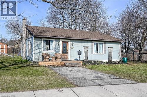 View of front facade with a chimney and roof with shingles - 703 Dunn Avenue, Hamilton, ON - Outdoor