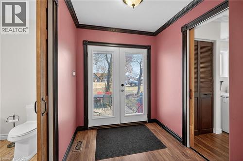Doorway to outside with french doors, wood finished floors, and ornamental molding - 703 Dunn Avenue, Hamilton, ON - Indoor Photo Showing Other Room