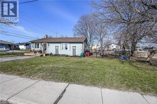 View of front of house featuring a chimney and a playground - 703 Dunn Avenue, Hamilton, ON - Outdoor