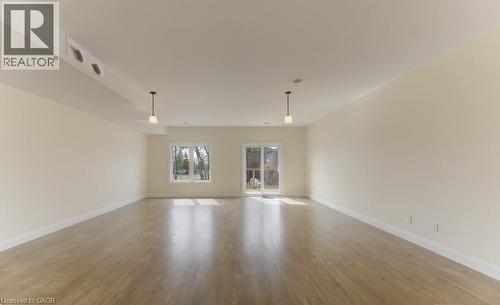 Unfurnished room featuring light wood-style floors and baseboards - 113 Walter Street, Kitchener, ON - Indoor