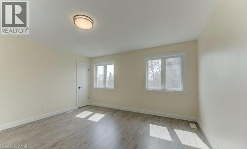 Unfurnished room with baseboards and light wood-style floors - 113 Walter Street, Kitchener, ON - Indoor Photo Showing Other Room