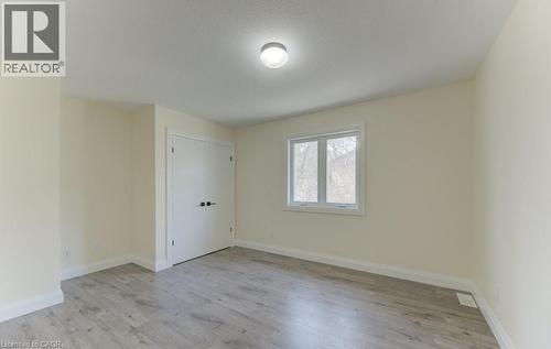 Unfurnished room featuring light wood finished floors and baseboards - 113 Walter Street, Kitchener, ON - Indoor Photo Showing Other Room