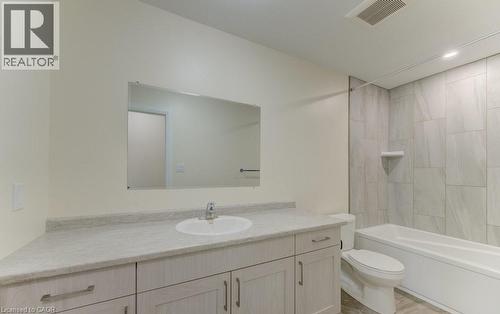 Full bath featuring vanity, bathing tub / shower combination, and recessed lighting - 113 Walter Street, Kitchener, ON - Indoor Photo Showing Bathroom