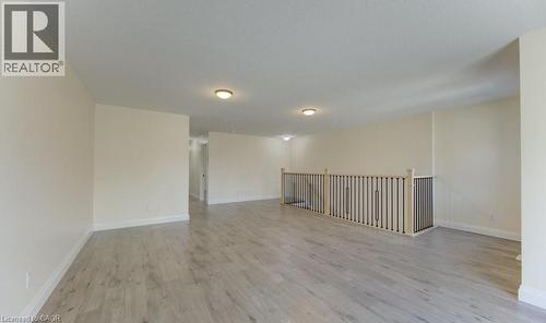 Empty room with light wood-style flooring and baseboards - 113 Walter Street, Kitchener, ON - Indoor Photo Showing Other Room