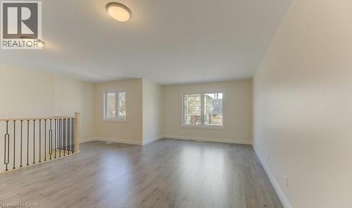 Spare room with baseboards and light wood finished floors - 113 Walter Street, Kitchener, ON - Indoor Photo Showing Other Room