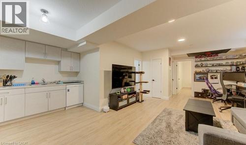 Living room featuring light wood finished floors, a desk, and recessed lighting - 113 Walter Street, Kitchener, ON - Indoor