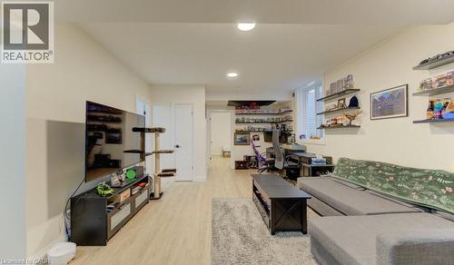 Living room with light wood-type flooring, a desk, and recessed lighting - 113 Walter Street, Kitchener, ON - Indoor