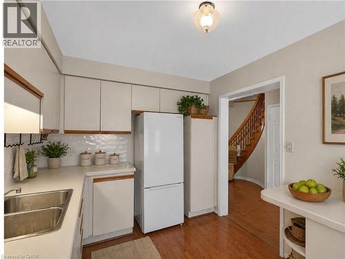 Virtually Staged / Enhanced - 86 Rita Avenue, Hamilton, ON - Indoor Photo Showing Kitchen With Double Sink