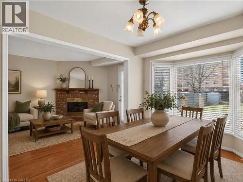 Virtually Staged / Enhanced - 86 Rita Avenue, Hamilton, ON - Indoor Photo Showing Dining Room With Fireplace