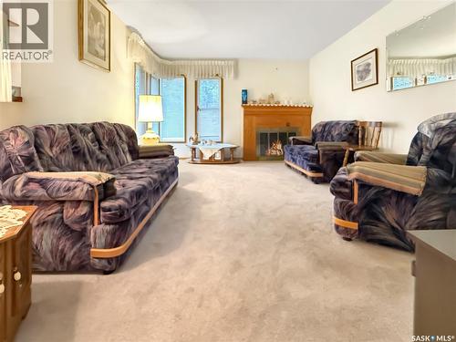 880 3Rd Avenue Ne, Swift Current, SK - Indoor Photo Showing Living Room With Fireplace