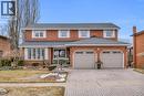 View of front facade with decorative driveway, a shingled roof, brick siding, a front lawn, and an attached garage - 228 Michener Crescent, Kitchener, ON  - Outdoor With Facade 