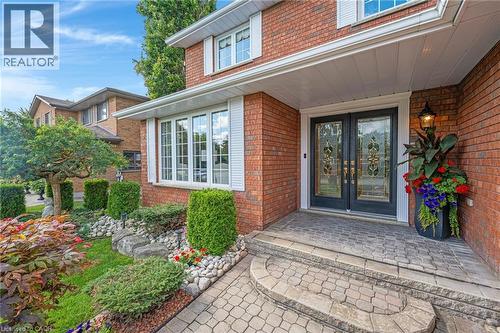 Doorway to property featuring brick siding and french doors - 228 Michener Crescent, Kitchener, ON - Outdoor