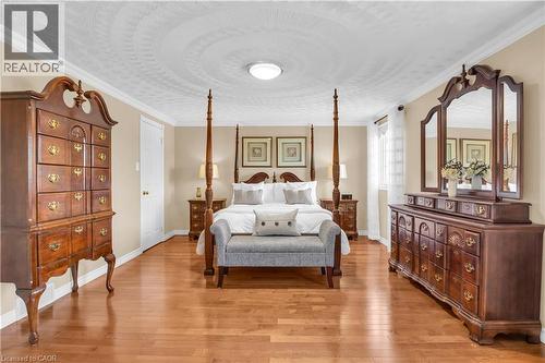 Bedroom with ornamental molding and light wood-style flooring - 228 Michener Crescent, Kitchener, ON - Indoor Photo Showing Bedroom