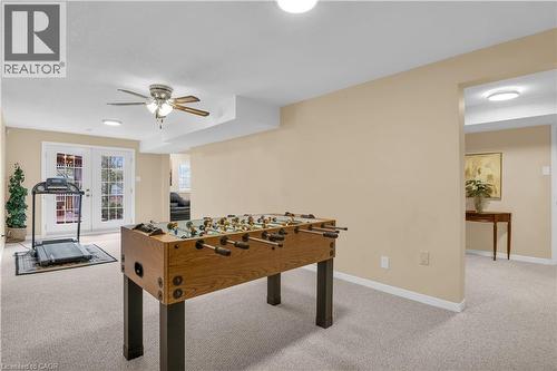 Recreation room with french doors, light colored carpet, and ceiling fan - 228 Michener Crescent, Kitchener, ON - Indoor Photo Showing Other Room