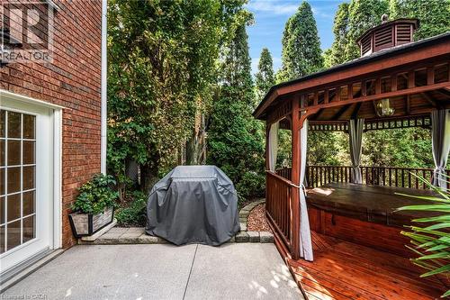 View of patio / terrace with area for grilling, a gazebo, a deck, a hot tub, and view of wooded area - 228 Michener Crescent, Kitchener, ON - Outdoor With Deck Patio Veranda With Exterior