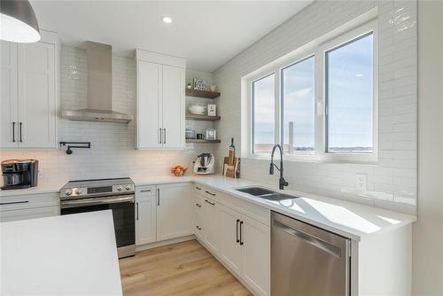 23 Murano Cove, Steinbach, MB - Indoor Photo Showing Kitchen With Double Sink