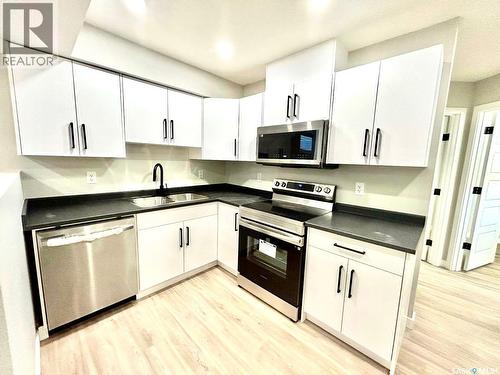 202 Cowessess Road, Saskatoon, SK - Indoor Photo Showing Kitchen With Stainless Steel Kitchen