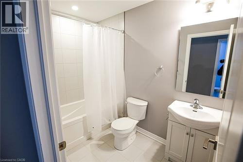 Bathroom featuring vanity, shower / tub combo, light tile patterned floors, and recessed lighting - 40 Pietz Avenue, Welland, ON - Indoor Photo Showing Bathroom