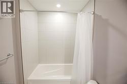 Full bathroom with shower / tub combo and toilet - 